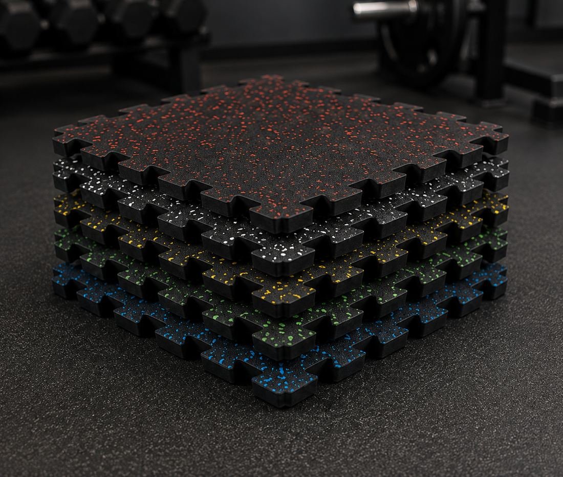 Stack of interlocking rubber gym floor tiles with coloured flecks